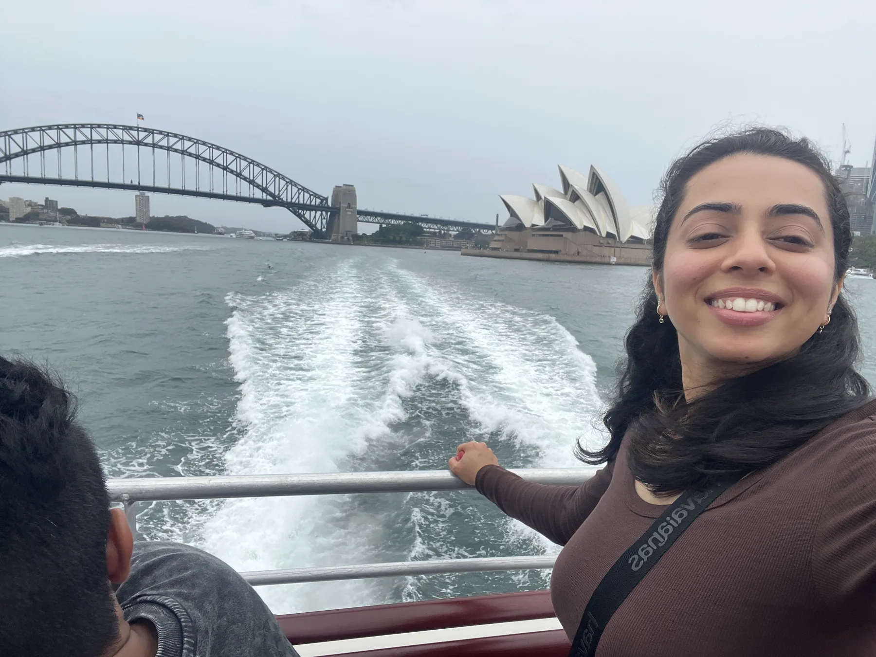 Priyanka in Sydney with the Harbour Bridge and Opera House behind her